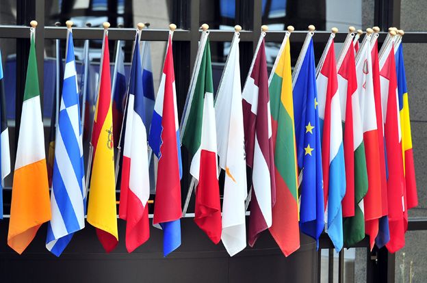 flags of European countries above the entrance of the European Council on May 21,2014 in Brussels