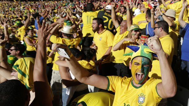 Brazil fans celebrate their team scoring during the World Cup