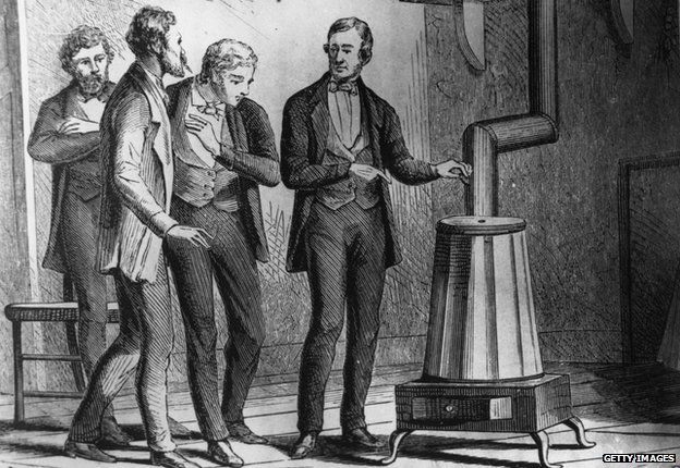 1839: American inventor Charles Goodyear (1800 - 1860) demonstrating his new dry heat rubber Vulcanization process