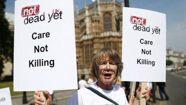 Opponent of assisted dying outside Parliament