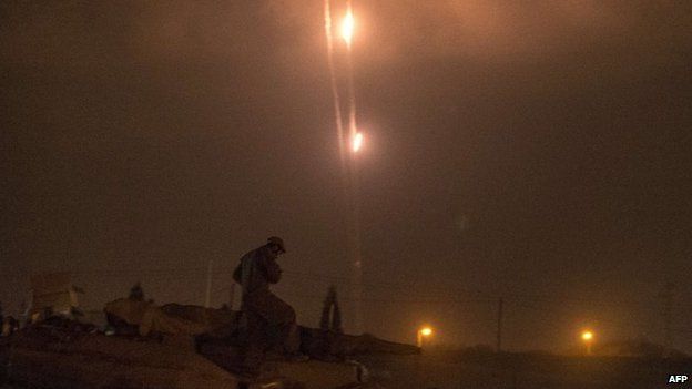 A picture taken from the southern Israeli-Gaza border shows rockets being fired from the Gaza Strip into Israel, 19 July 2014