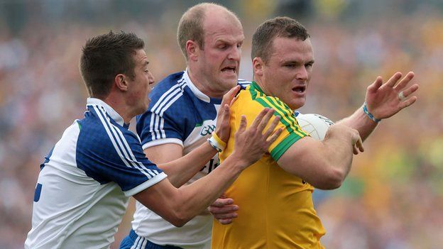 Donegal's Neil McGee attempts to burst away from Ryan Wylie and Dick Clerkin