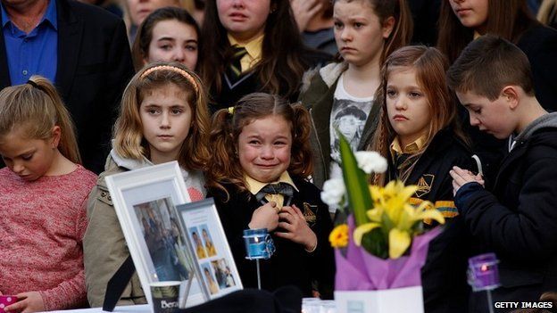 Mourners attend a memorial service in Melbourne held for a family of five killed in the flight MH17 crash - 20 July 2014