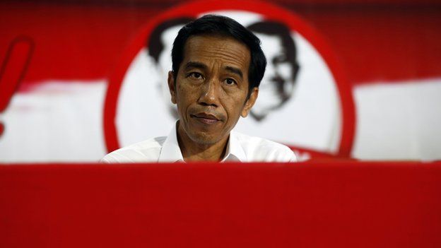 Indonesian presidential candidate Joko Widodo looks on during a speech to his supporters in Serang, Banten province on 16 July, 2014