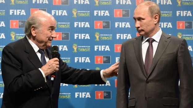 Fifa president Sepp Blatter (L) and Russia's President Vladimir Putin during a handover ceremony for the 2018 World Cup in Rio de Janeiro on 13 July, 2014