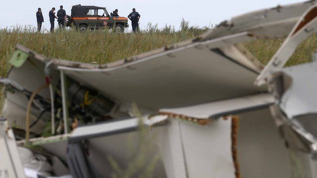 Members of the Ukrainian Emergencies Ministry gather before leaving the crash site of the Malaysia Airlines Flight MH17