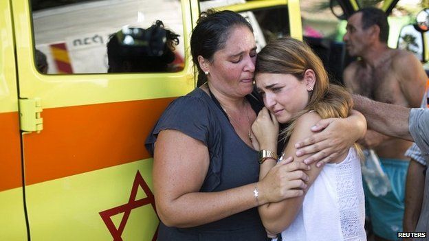 Israelis react after a rocket fired by Palestinian militants in Gaza landed in the southern city of Ashkelon - 21 July 2014