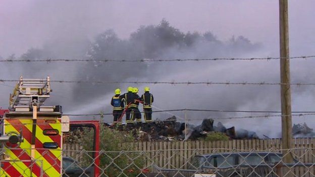 Firefighters work to bring the blaze under control