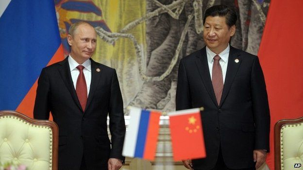 Russia President Vladimir Putin and China President Xi Jinping at a signing ceremony for landmark gas deal