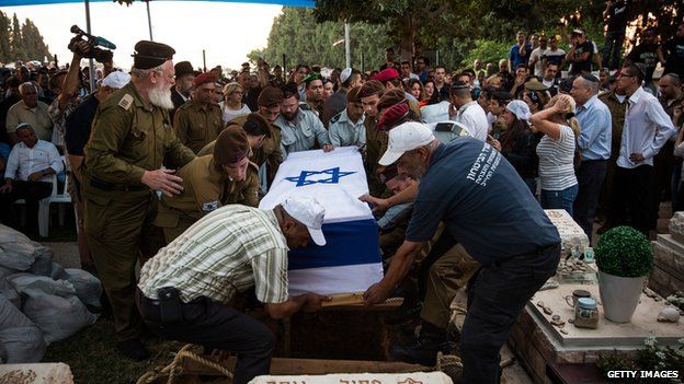 The casket carrying the body of Israeli soldier Jordan Bensimon is carried to the burial site during his funeral on July 22, 2014 in Ashkelon, Israel