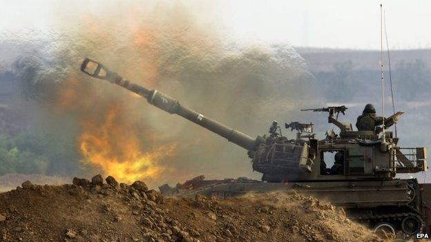 An Israeli 155mm self-propelled howitzer fires from a position at an unspecified location in southern Israeli into the Gaza Strip, 23 July 2014