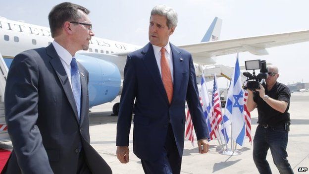 US Secretary of State John Kerry (centre) walks with US embassy Deputy Chief of Mission Bill Grant at Ben Gurion airport as he arrives in Israel, 23 July 2014