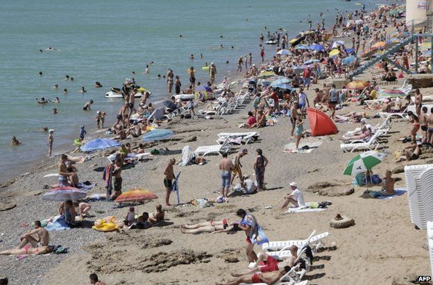 Holidaymakers on a beach in Crimea, 29 June 2014