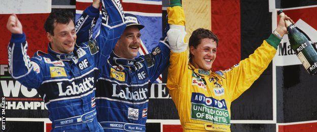 Nigel Mansell of Great Britain celebrates winning with 2nd placed team mate Riccardo Patrese and third placed Michael Schumacher during the Mexican Grand Prix on 22nd March 1992 at the Autodromo Hermanos Rodríguez in Mexico City, Mexico.