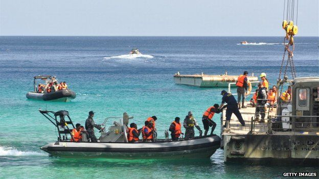 Suspected asylum seekers arrive at Christmas Island, after receiving assistance by Australian Navy, on 13 October 2012 on Christmas Island.