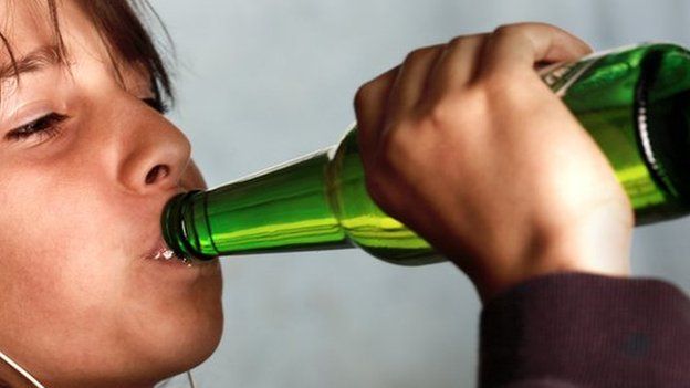Young person drinking alcohol