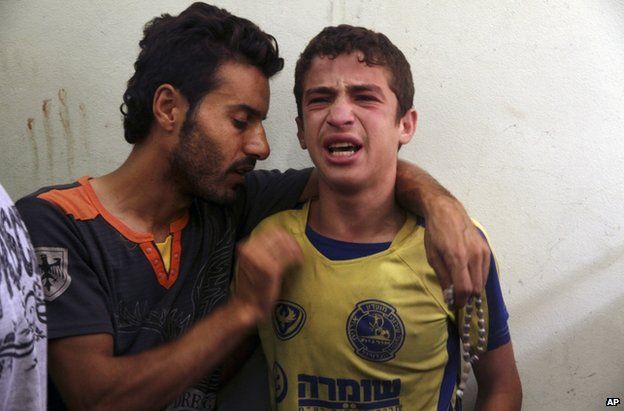 Mourners at a funeral in Beit Hanoun, Gaza, 25 July