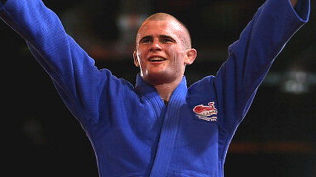 England's Danny Williams celebrates winning gold in the men's -73kg judo