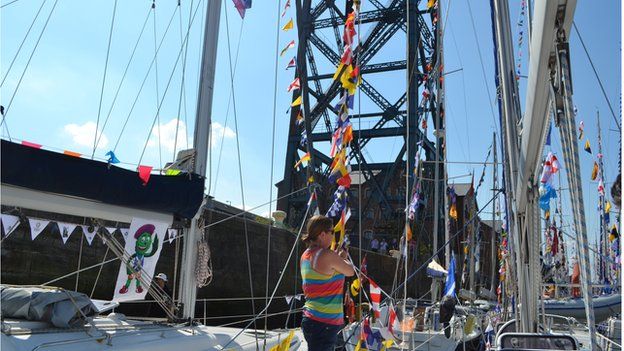 Raising flags on Clan yacht