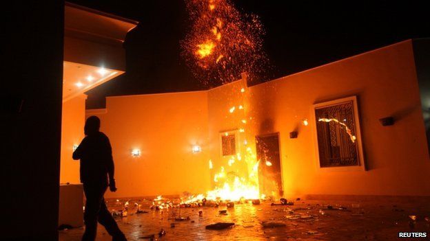 The US Consulate in Benghazi is seen in flames during a protest by an armed group said to have been protesting a film being produced in the US on 11 September 2012