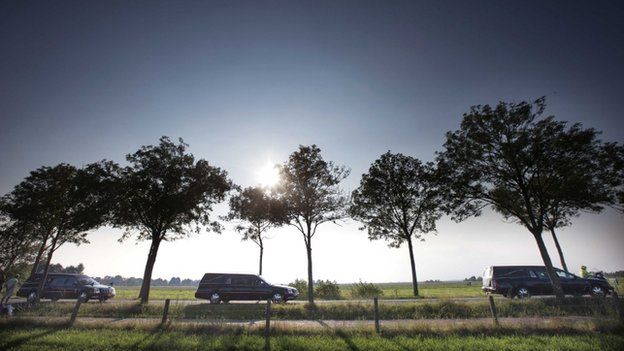 The column of funeral hearses drive near Nieuwegein after leaving the airbase in Eindhoven to Hilversum, The Netherlands, 26 July 2014,