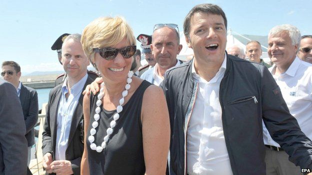 Italian Prime Minister Matteo Renzi (R) with Italian Defence Minister Roberta Pinotti (L) arrives at the site where the Costa Concordia is moored