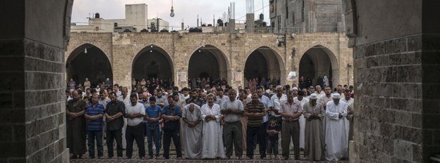 Palestinian Muslims mark Eid al-Fitr in Gaza City, 28 July