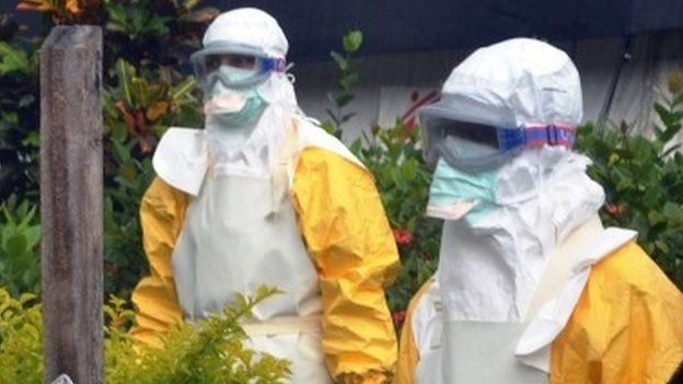 MSF Ebola workers wearing protective clothing - 23 July 2014 - in Guinea