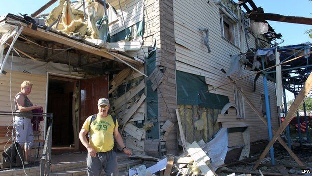 A man stands in rubble of a damaged house in Horlivka, Ukraine, on 27 July 2014.