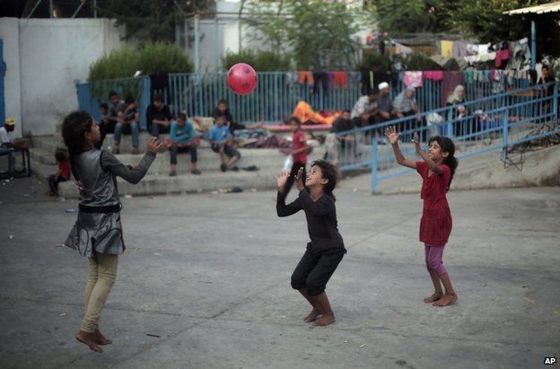 Palestinian children play at a UN school in Jabaliya refugee camp, Gaza, 28 July