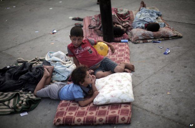 Palestinian children rest on the floor at a UN school in Jabaliya refugee camp, Gaza, 28 July