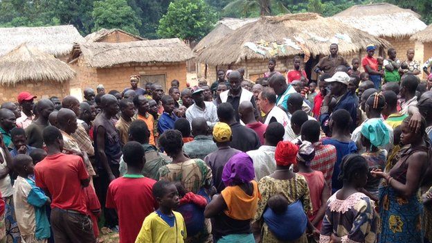 MSF's Dr Pension talking to a villagers outside Bambari, CAR - July 2014