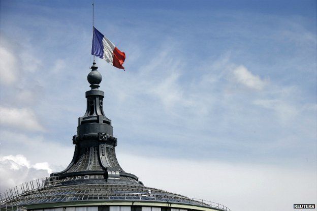 A French flag flying half-mast at the Grand Palais in Paris - 28 July 2014
