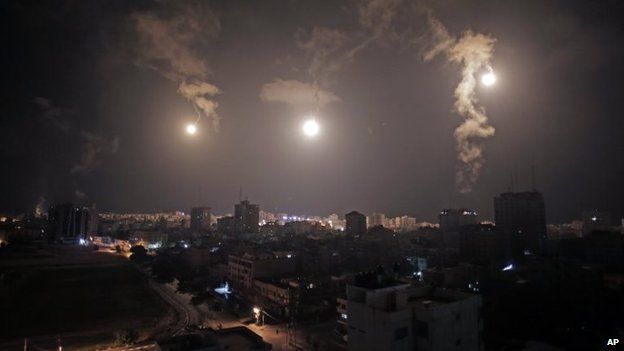 Israeli forces' flares light up the night sky of Gaza City on early Tuesday, 29 July 2014