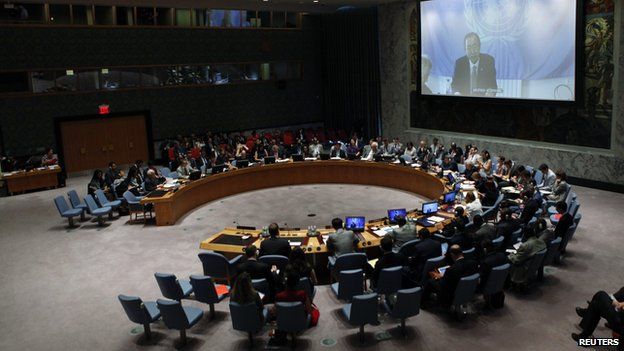 Members of the Security Council watch UN Secretary General Ban Ki-Moon on a screen while they attend a meeting about the situation in the Middle East, including Palestine, at United Nations headquarters in New York, July 22