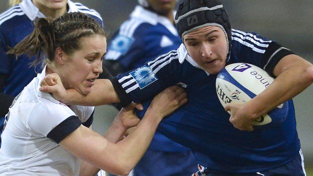 France wing Shanon Izar (right) tries to hold off England full-back Emily Scarratt in this year's Six Nations