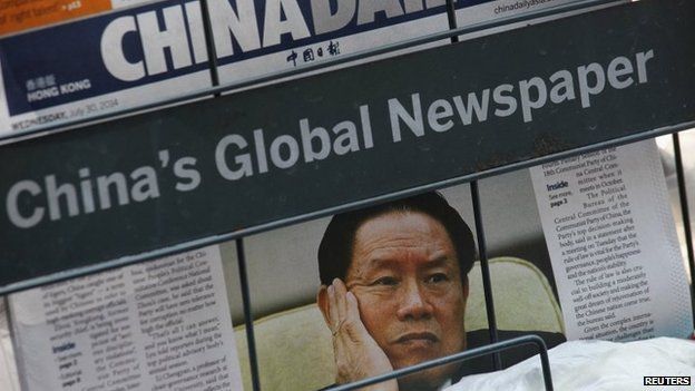 A newspaper with a picture of China's then Politburo Standing Committee Member Zhou Yongkang is seen at a newsstand in Hong Kong on 30 July 2014