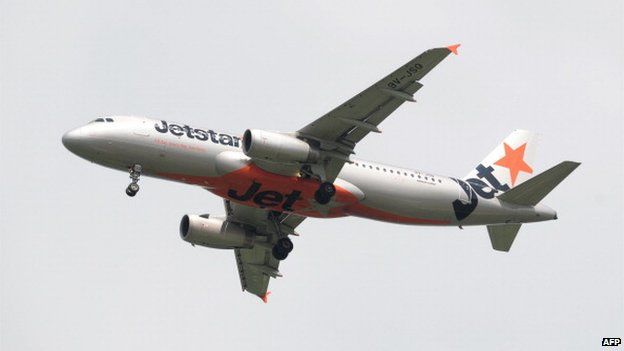 This photograph taken on 4 May 2014 shows an aircraft of Australian low-cost carrier Jetstar Airways approaching Changi International Airport in Singapore