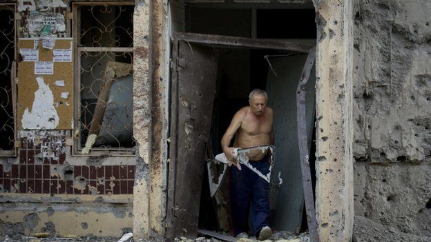 Damaged houses after a shell hit a residential area in Donetsk, Ukraine, on 29 July 2014.