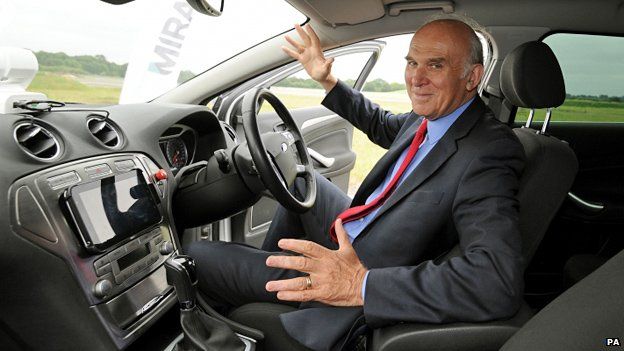 Business Secretary Vince Cable sits in a driverless car