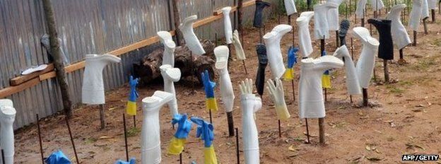 Protective gear drying after being used in treatment room in Liberia