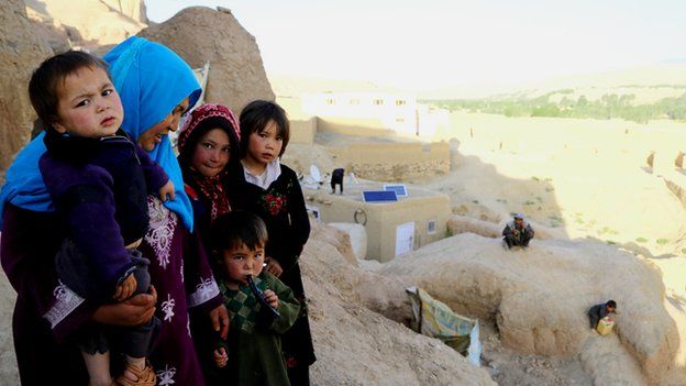 From livestock to satellite dishes: Some Bamiyan families have adapted caves to suit their needs