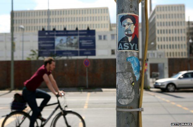 A poster near the partially finished new headquarters of Germany's Federal Intelligence Service in Berlin calling for asylum for Edward Snowden, 12 July