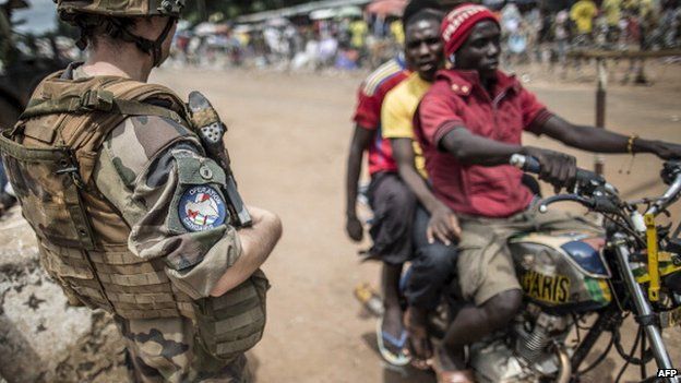 A French soldier mans a checkpoint in the formerly Muslim PK12 district of Bangui, CAR, on 4 June 2014