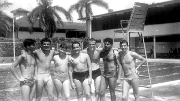 Boys in front of a pool
