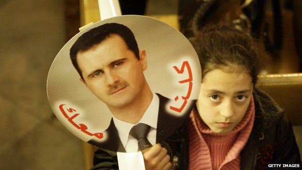 Girl with a picture of President Bashar al-Assad
