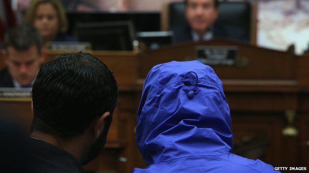 Caesar, hooded during the hearing