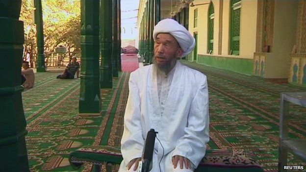 Jume Tahir speaks during an interview at Id Kah Mosque in Kashgar in this still image taken from video dated 3 August 2011