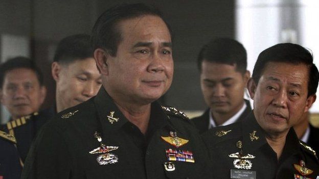In this 13 June 2014 file photo, Thailand's Army commander General Prayuth Chan-ocha, left, arrives at the Royal Thai Army Club in Bangkok, Thailand.