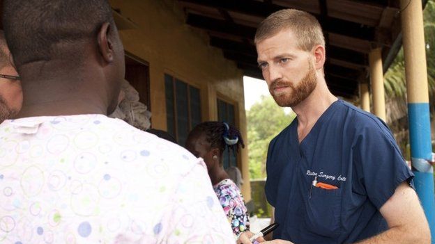 Dr. Kent Brantly (R) speaks with colleagues at the case management center on the campus of ELWA Hospital in Monrovia, Liberia